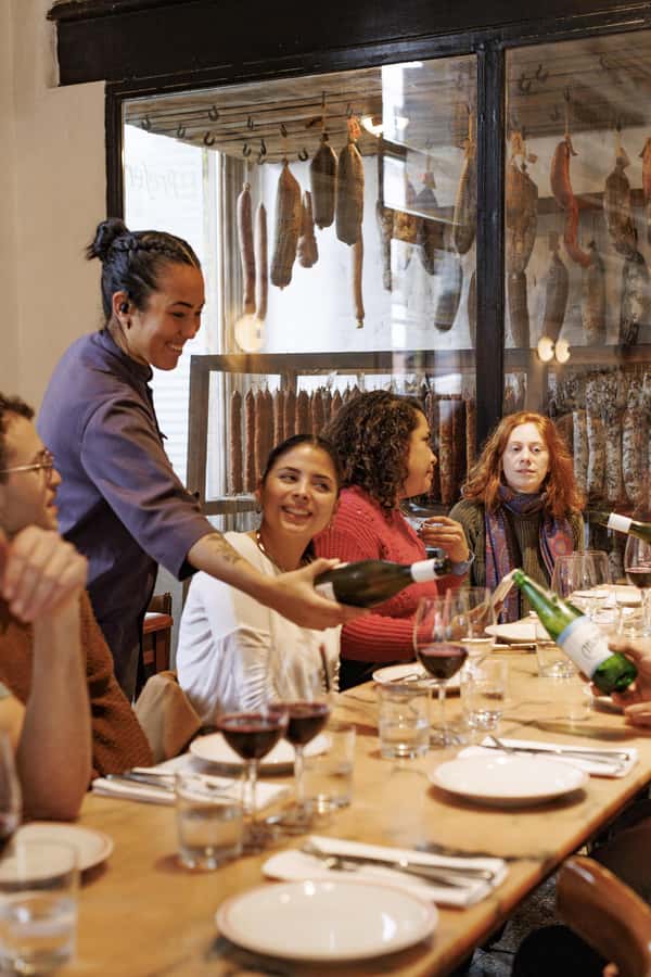 Buenos Aires: Local Foodie Adventure with Sherpa Food Tours - Stop 3: the iconic bodegón table of milanesa, tortilla, and fainá