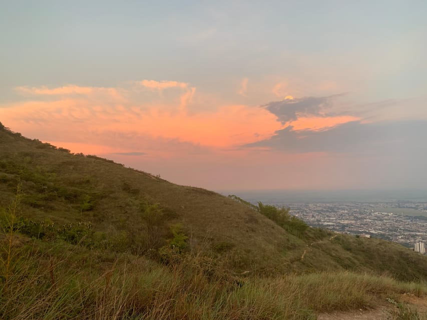 Cali: TRES CRUCES - Cali's most popular hike and monument - Sunset over Cali and the Andes: the moment most people come for