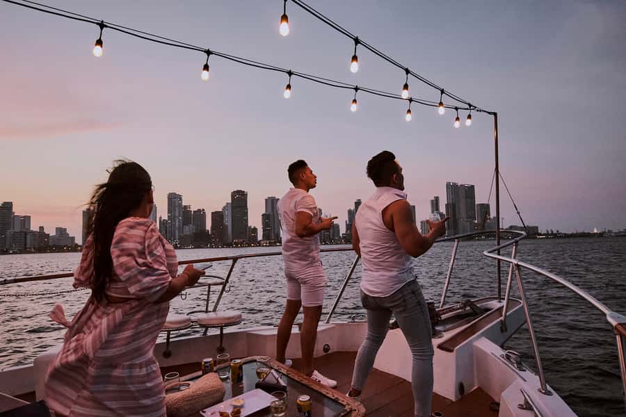 Cartagena: Sunset Cruise with Open Bar - Sailing out past Bocagrande and toward the lighthouse