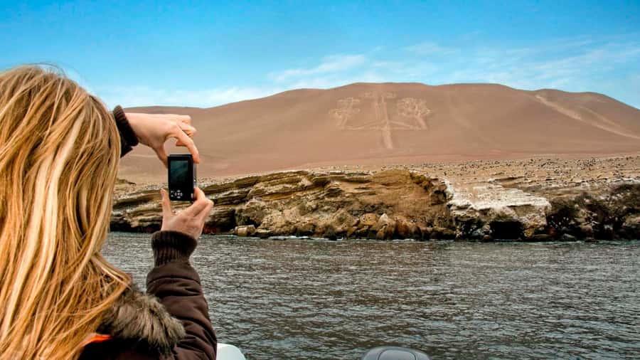 From Lima: Paracas and Huacachina Oasis Full Day Guided Tour - Huacachina oasis at sunset: dunes, buggy, and sandboarding
