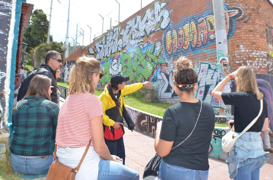 Graffiti Tour in La Candelaria Bogotá with Transportation - The narrow street of indigenous ancestry stories
